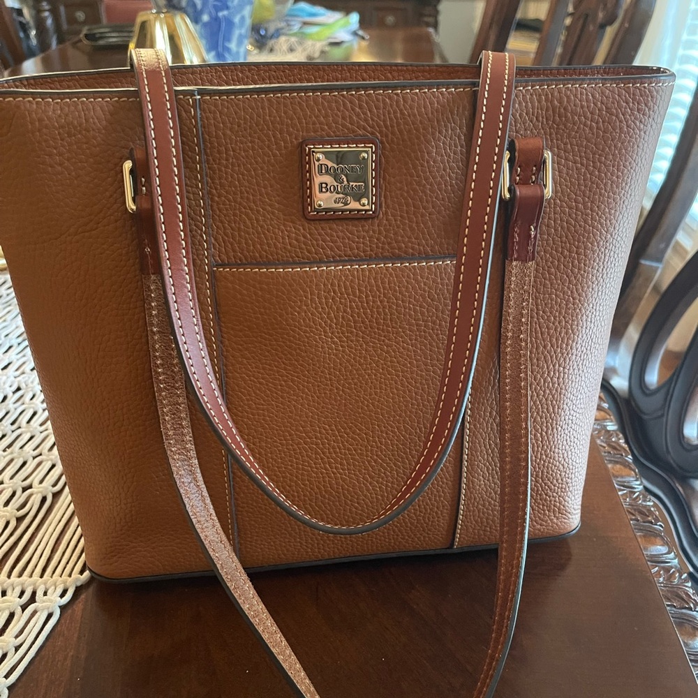 SOLD SOLD. Dooney & Bourke a down Leather tote. Shoulder strap